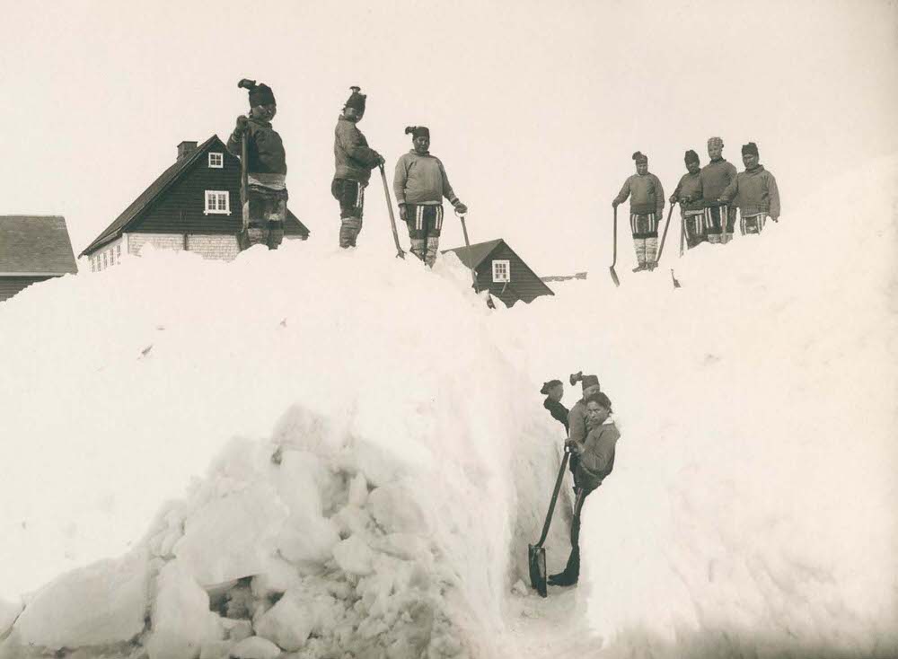 Residents clear snow in the town of Nuuk, 1890s
