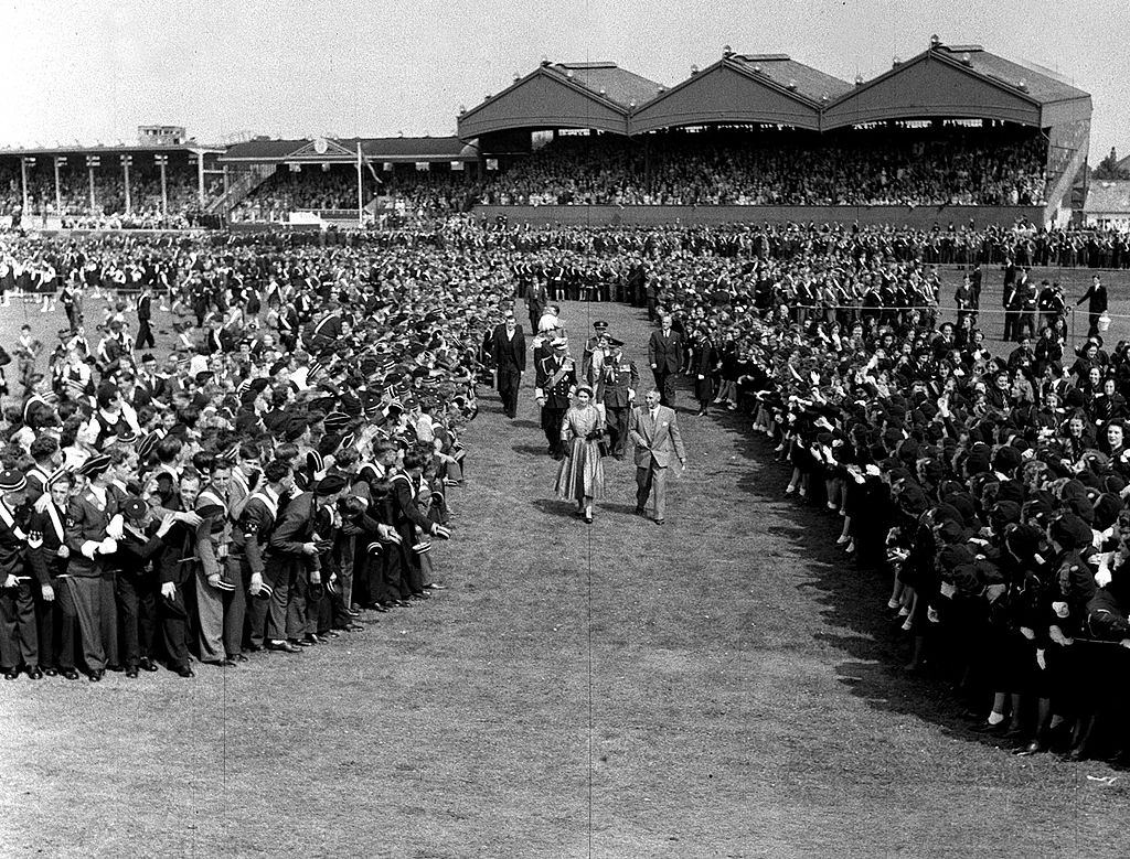 Queen Elizabeth II passes through the thousands of Ulster Youth Organisations at Balmoral, Belfast, 1953.