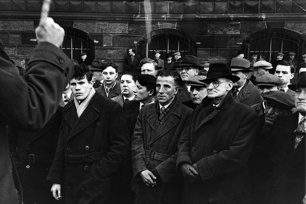 A crowd of working men listen to Sunday afternoon speakers on religion at the Customs House, Belfast, 1954.
