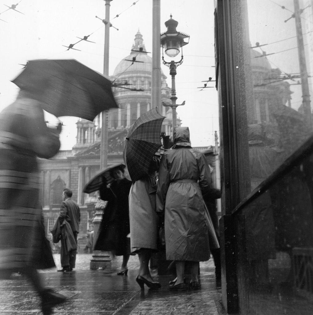People in Belfast on a rainy day, 1954.