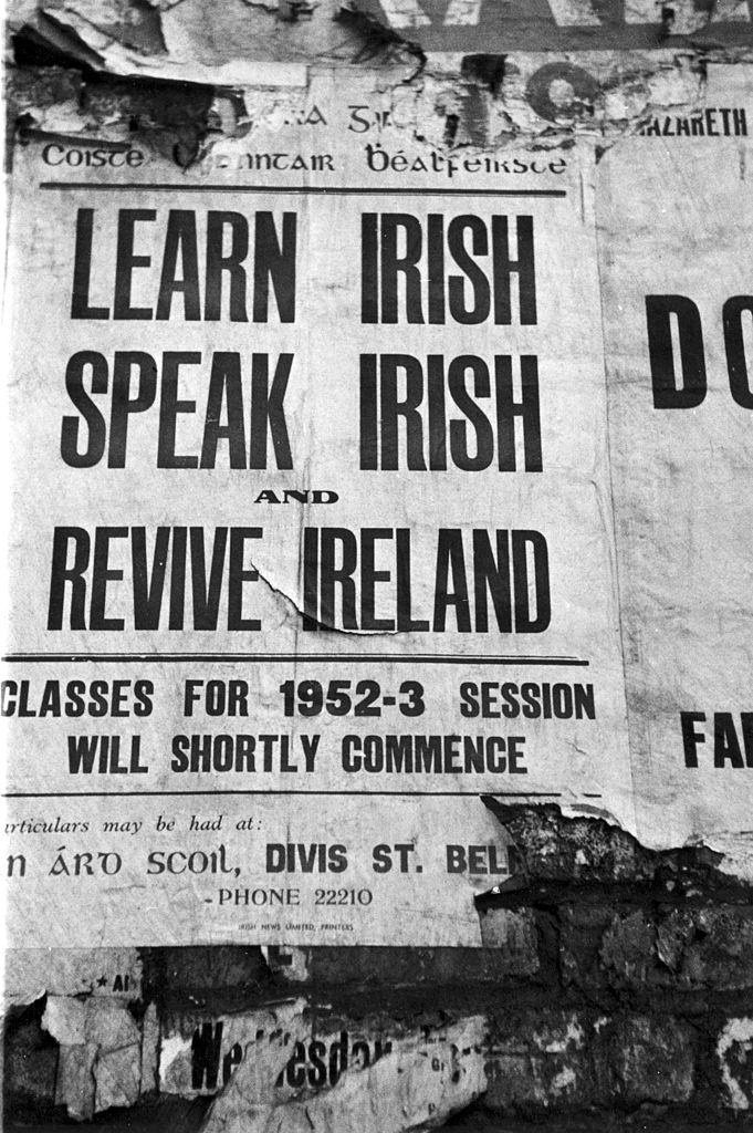 A poster advertising lessons in the Irish language on a wall in Belfast, 1954.