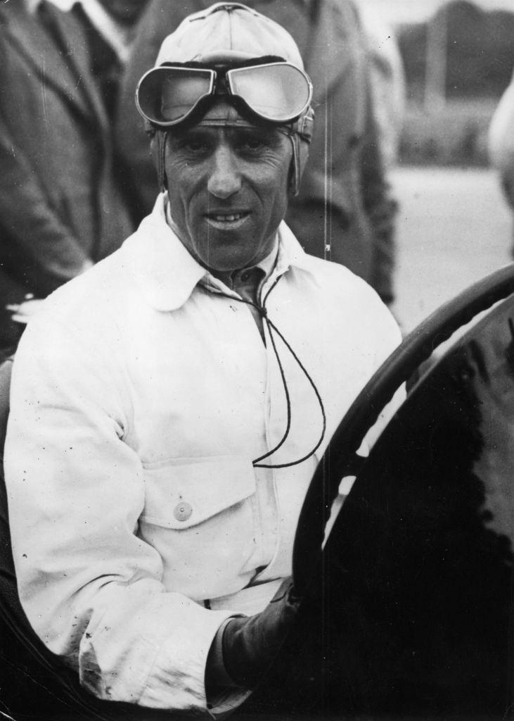 Tazio Nuvolari also know as Il Campionissimo (The Great Little Man) being congratulated by his wife on his win in an Ulster TT car race held in Belfast, 1950.