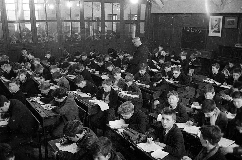A crowded classroom where 248 children are taught at once in a Belfast school, 1954.