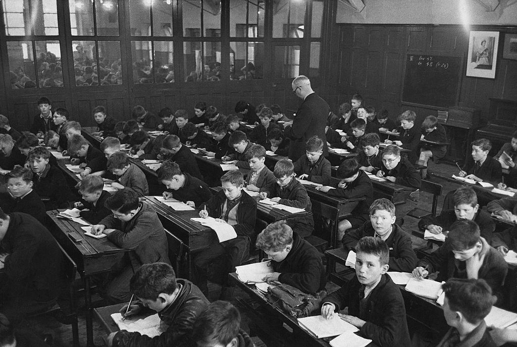 Students in study in an overcrowded classroom in Belfast, 1954.