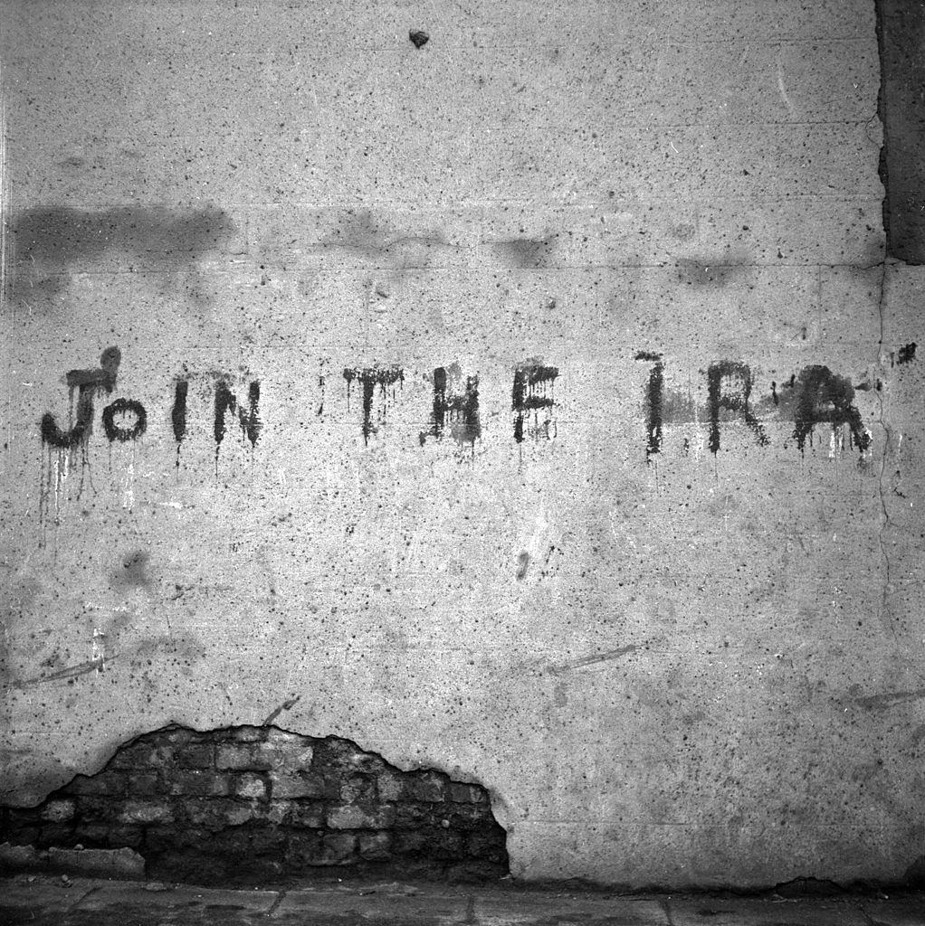 A spray painted message on a wall in Belfast reading 'Join The IRA', 1954.