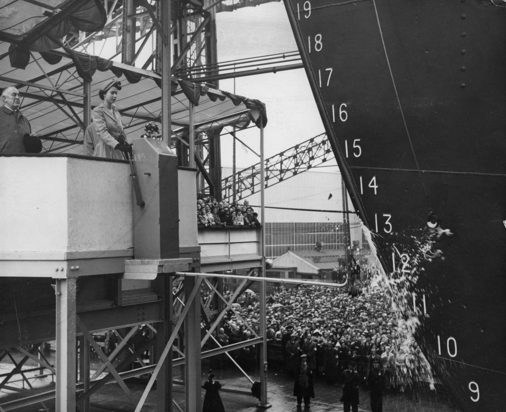 A bottle of Empire champagne shatters against the new Shaw Savill liner Southern Cross at the launch by Queen Elizabeth II, 1954.