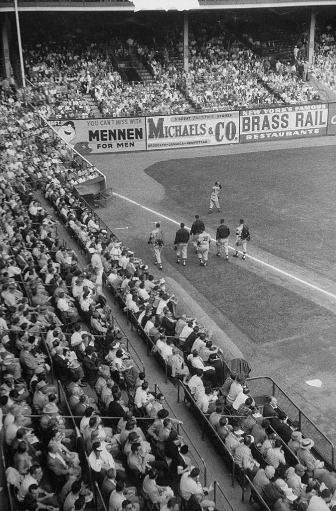 Fans watching a game between the Milwaukee Braves and the Brooklyn Dodgers at Ebbet's Field.