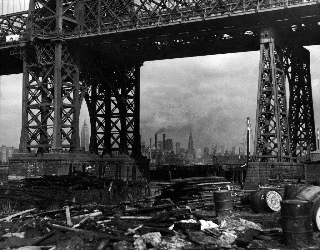 Williamsburg Bridge and the Manhattan skyline taken from under the bridge on the Brooklyn side, New York City, 1950.