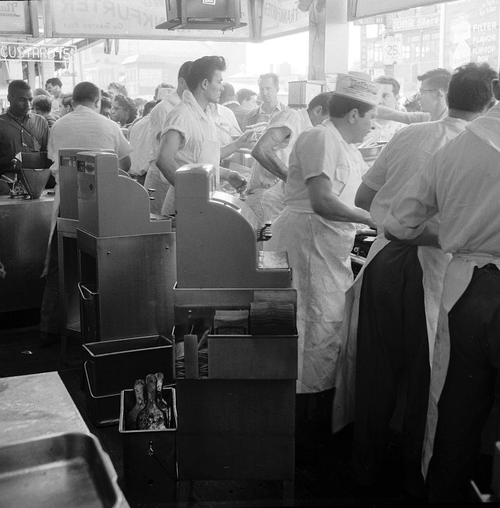 The cash registers are busy at Nathan's famous hotdog stand in Coney Island, New York City, 1955.