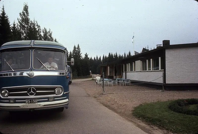 A group of foreign tourists in a bus at the border between the USSR and Finland.