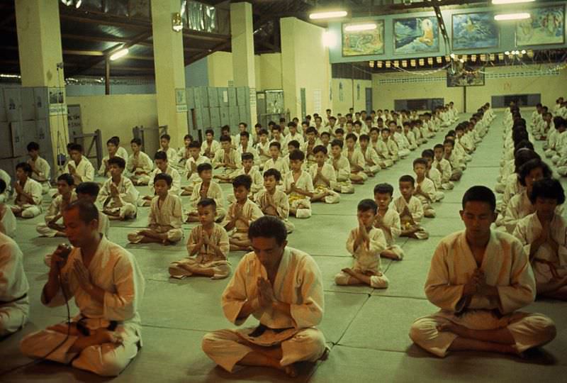 A monk and judo expert leads a class in meditation before a match in Saigon, 1965