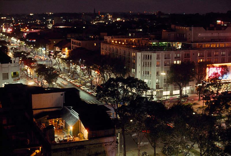 Lights and traffic on Le Loi Boulevard light up the night in Saigon, 1965