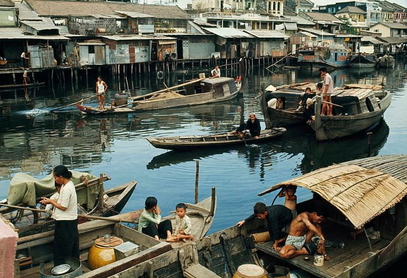 Looking for living space, families live in sampans and shacks in Saigon, 1965