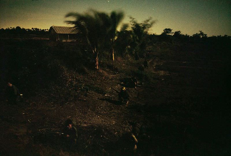 Members of a home guard patrol their neighborhood at night in Saigon, 1965