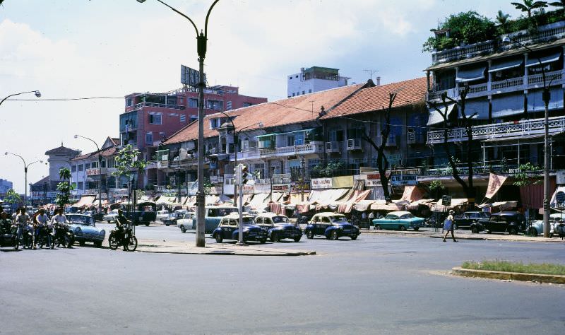 Saigon's "Saigon Taxis" wait at signal, 1968