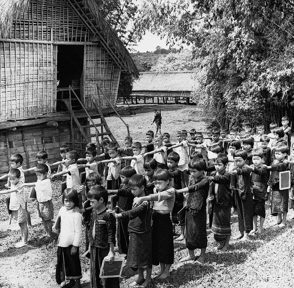 Children of Buen Enac line up outside their new school, 1960.
