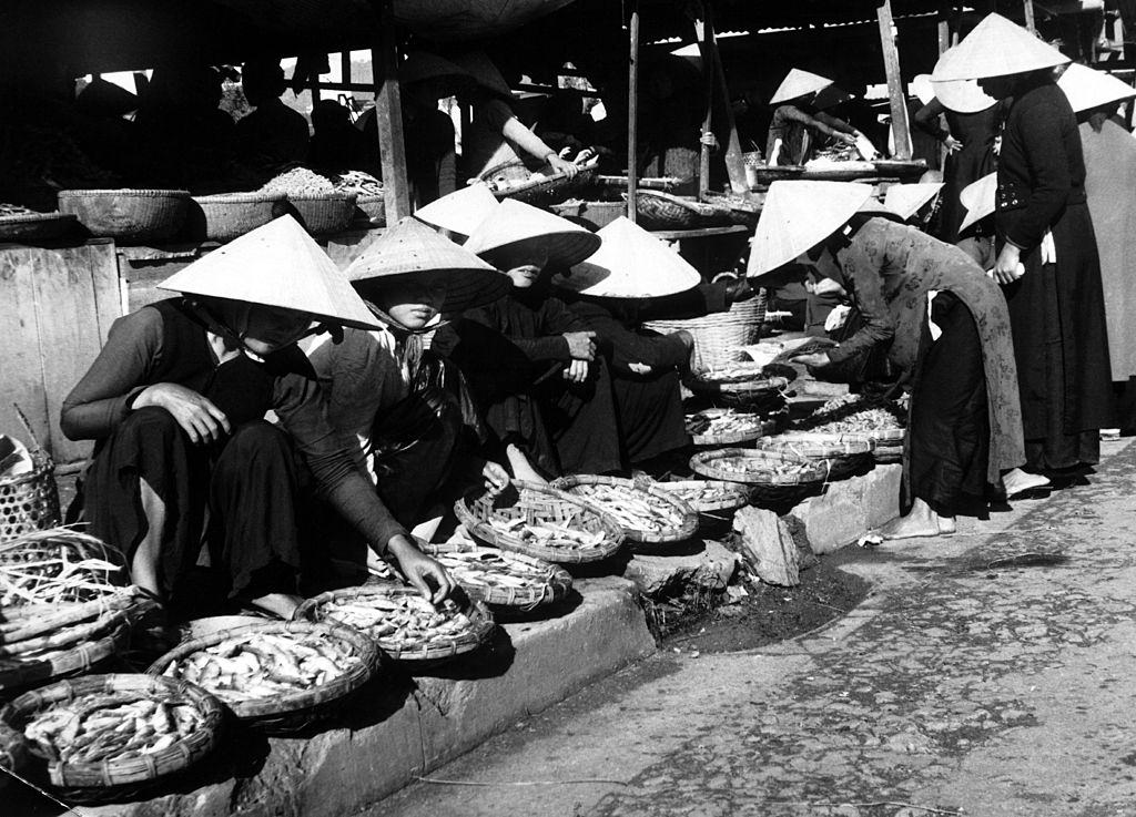 A market-place in South Vietnam, at the junction between a small railroad track going from the South to the frontier, 1960.