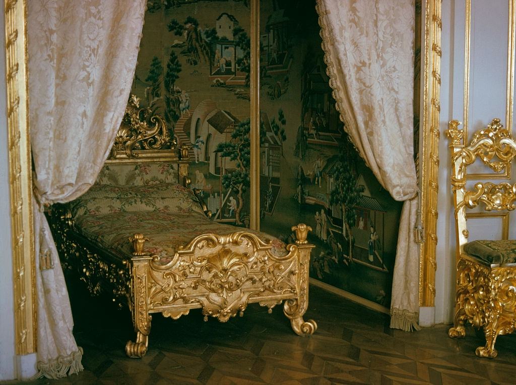 A luxurious bedroom with a gold bed and Chinese wallpaper in the Hermitage Museum, Leningrad, 1973.