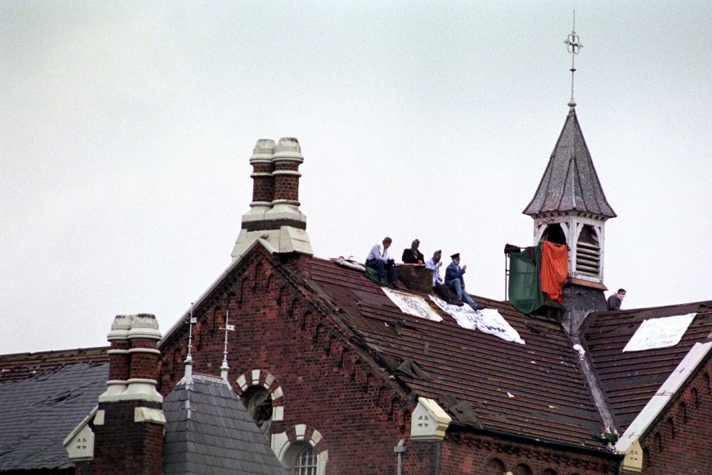 Prisoners on the roof of Strangeways Prison in Manchester during the riot, 1990.