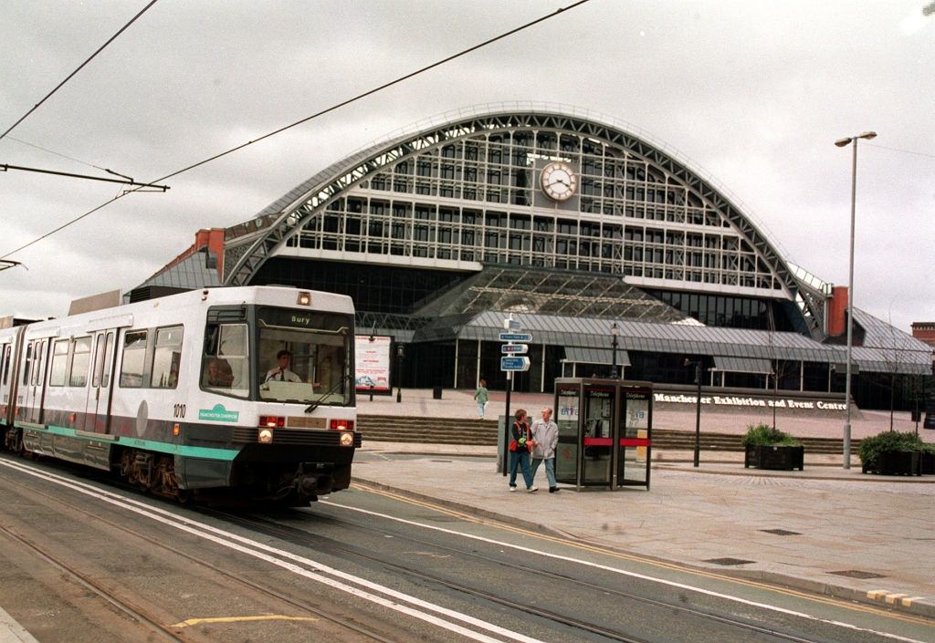 A Metro Link tram in Manchester passes the G-Mex Centre, 1993.