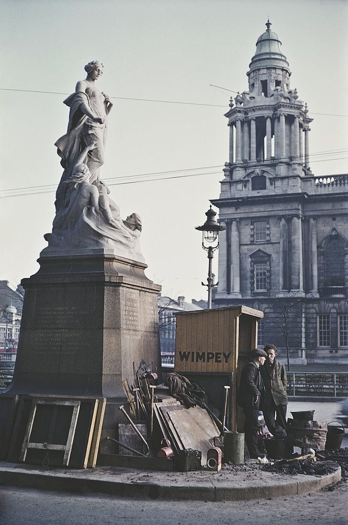 Two workmen by the Titanic Memorial outside Belfast City Hall, 1955.