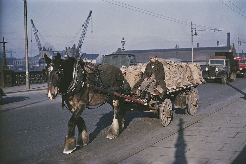 A horsedrawn cart carrying sacks of potatoes over a bridge in Belfast, 1955.