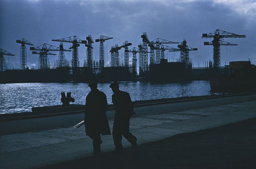 Two men on the quayside at the Harland & Wolff shipyard in Belfast, 1955.
