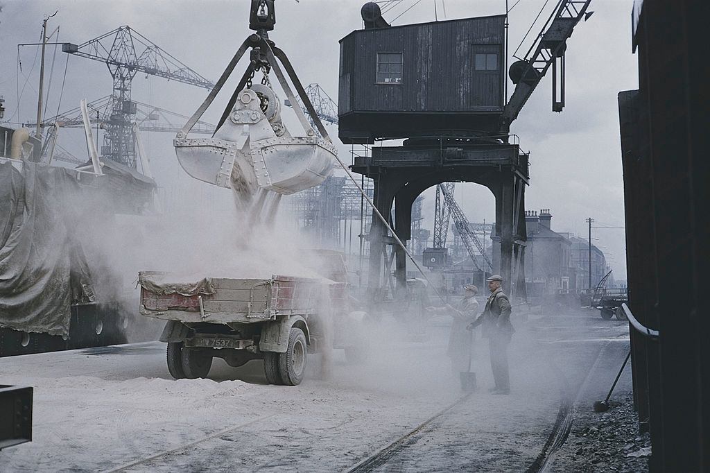 A crane loading a truck on the quayside at the Harland & Wolff shipyard in Belfast, 1955