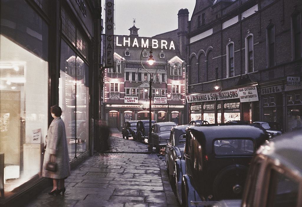 A view down a street towards the Alhambra Theatre in Lower North Street, 1955.