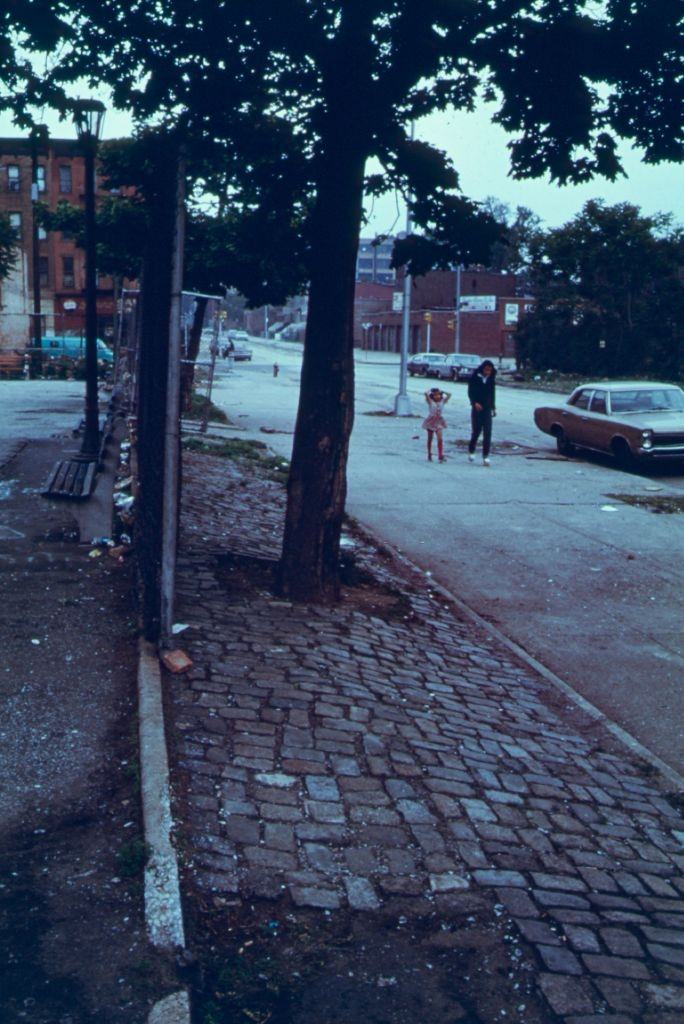 Woman and child walking in Lynch Park in Brooklyn, 1974.