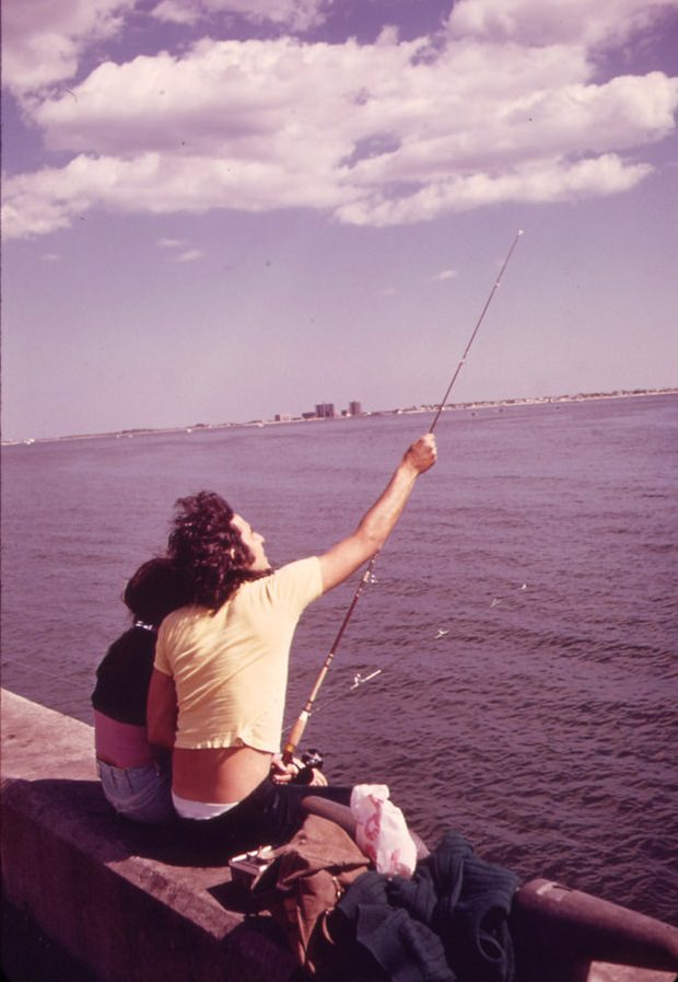 Couple fishing in Plum Beach, 1973
