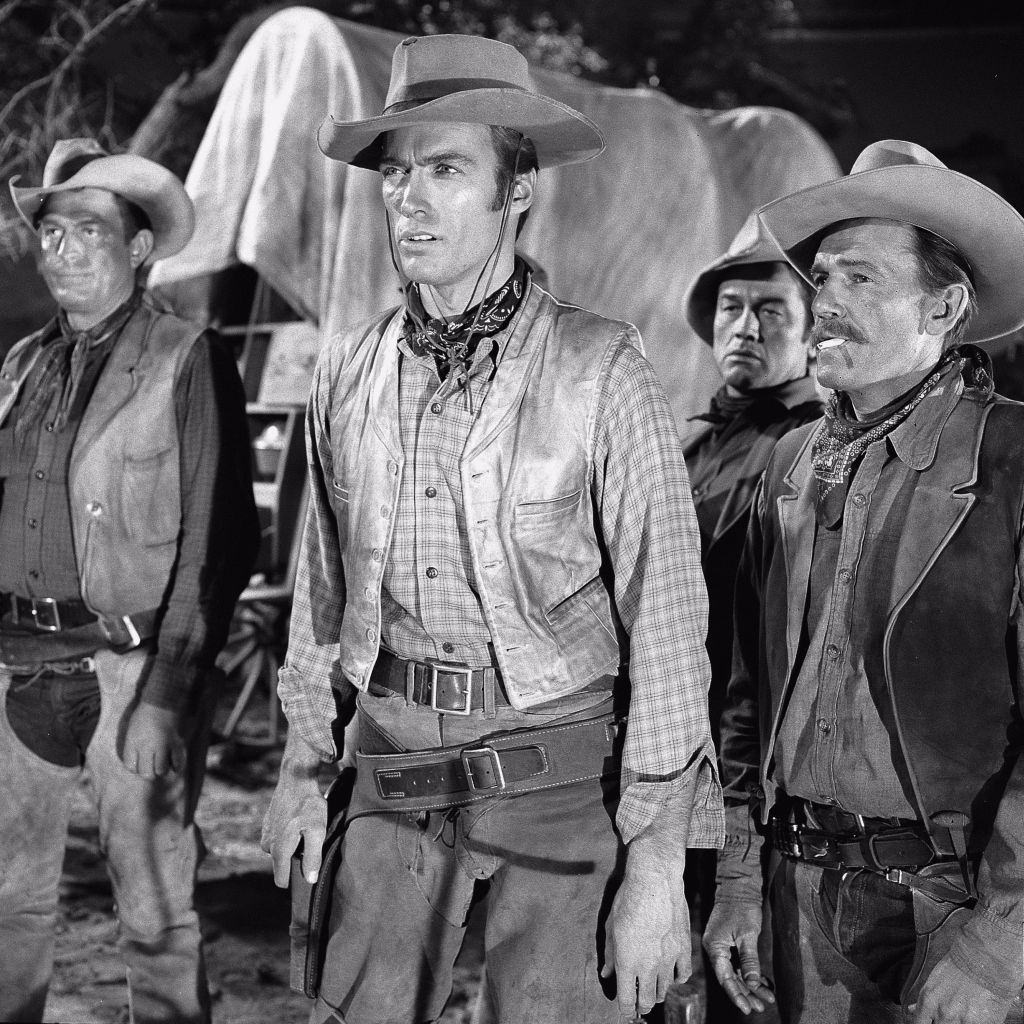 Clint Eastwood stands with a three other cowboys on the set of the television series 'Rawhide,' 1959.