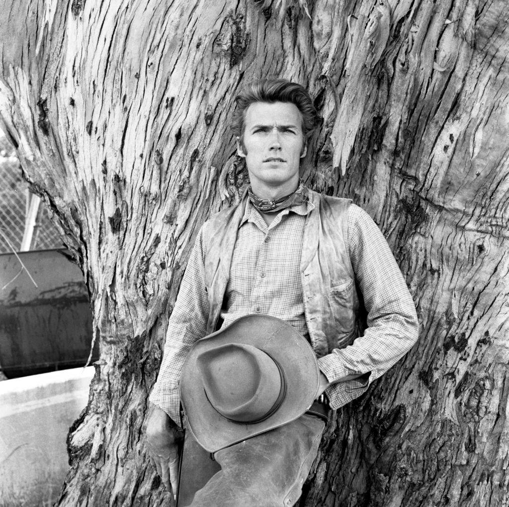 Clint Eastwood posing by a tree, 1960.