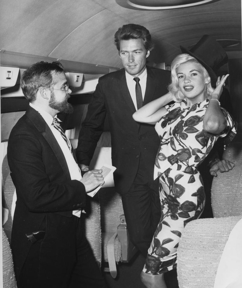 Clint Eastwood and Jayne Mansfield greeted by local artist Bob McClay, 1962.