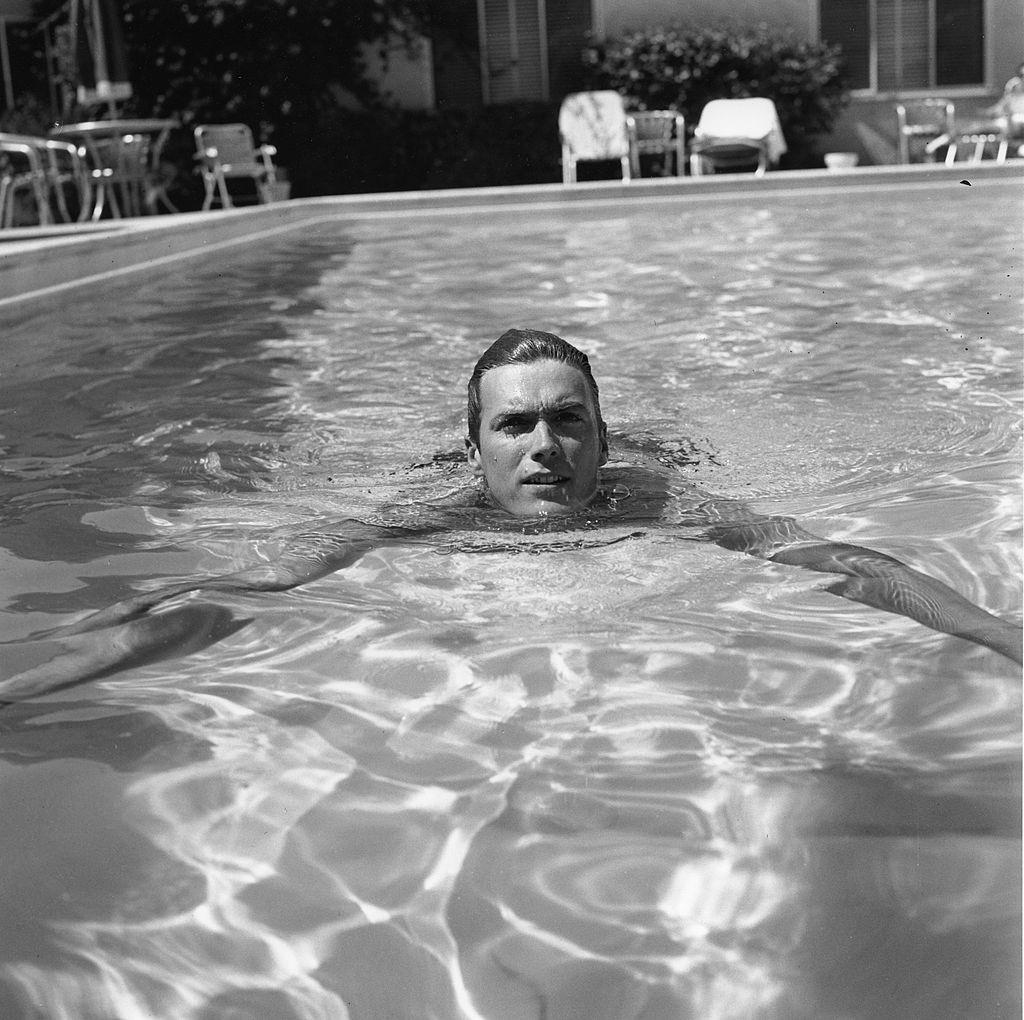 Clint Eastwood takes a swim in his house, 1956.