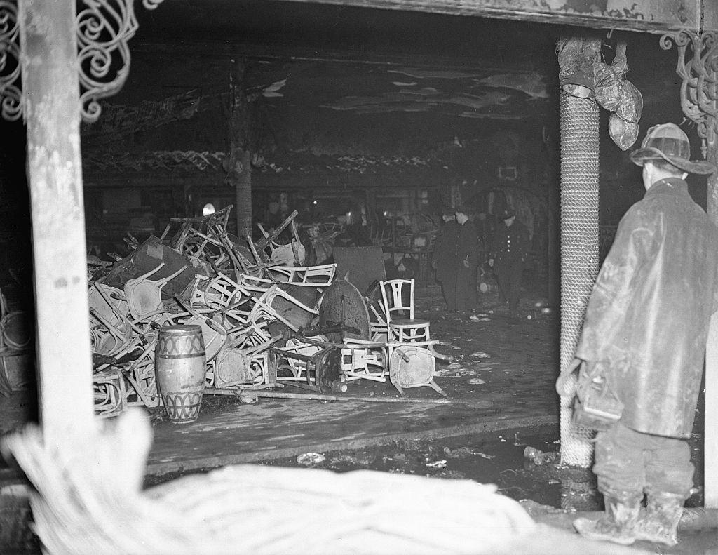 A fireman surveys the ruins of the Cocoanut Grove Night Club, destroyed by fire last night (November 28).