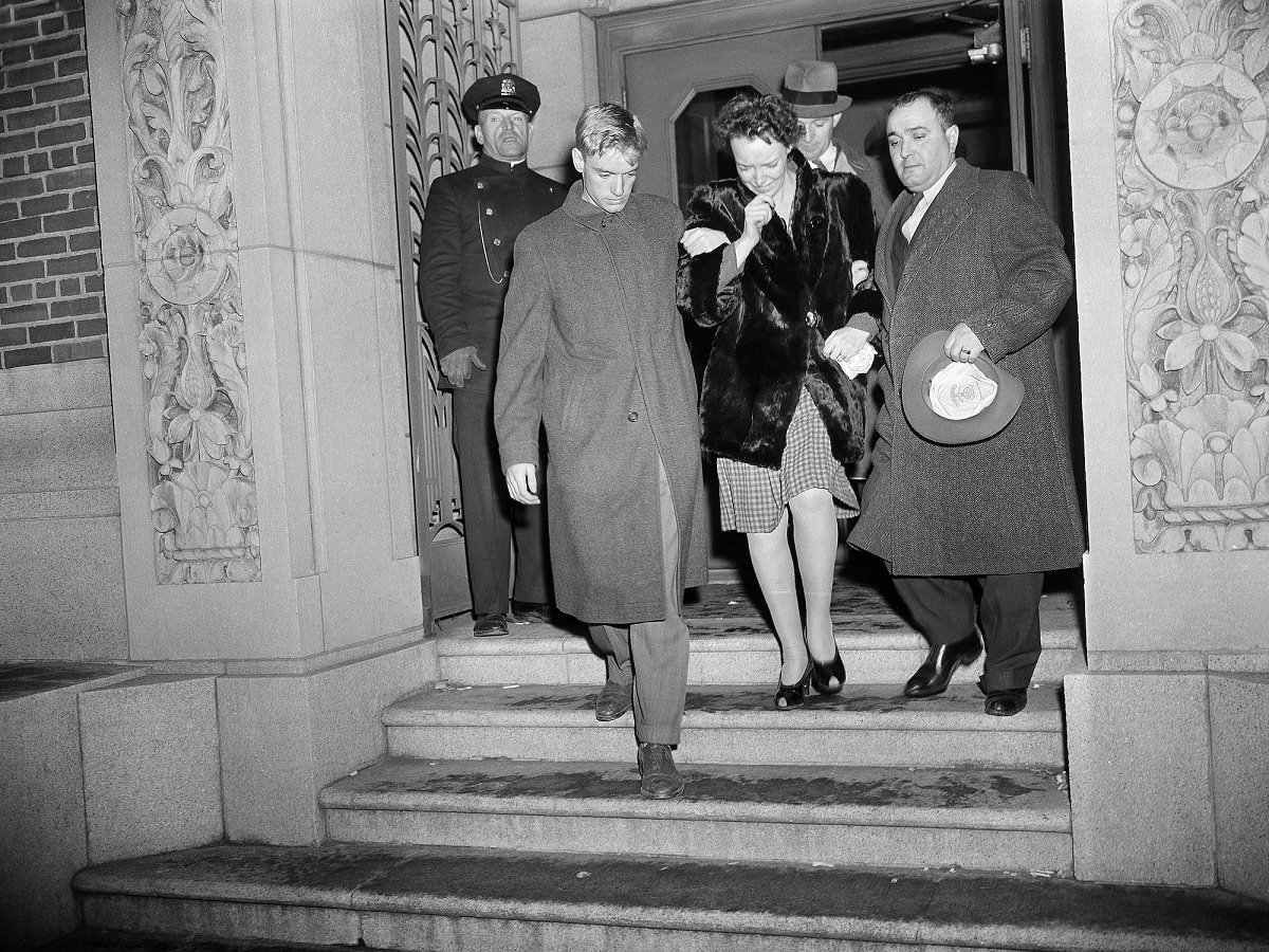 Relatives leave a mortuary after identifying the bodies of loved ones taken from the charred ruins of the Cocoanut Grove.