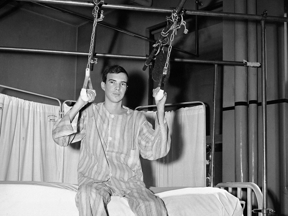 Clifford Johnson, 21, exercises on special equipment over his bed in Boston City Hospital, Sept. 16, 1943.