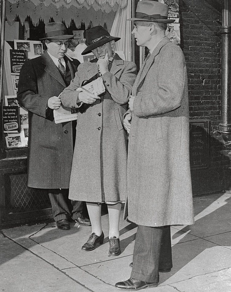 Edith Adams, head of Homestead House at Wellesley College, eaving the morgue after identifying the body of Margaret Whitson, one of her students.