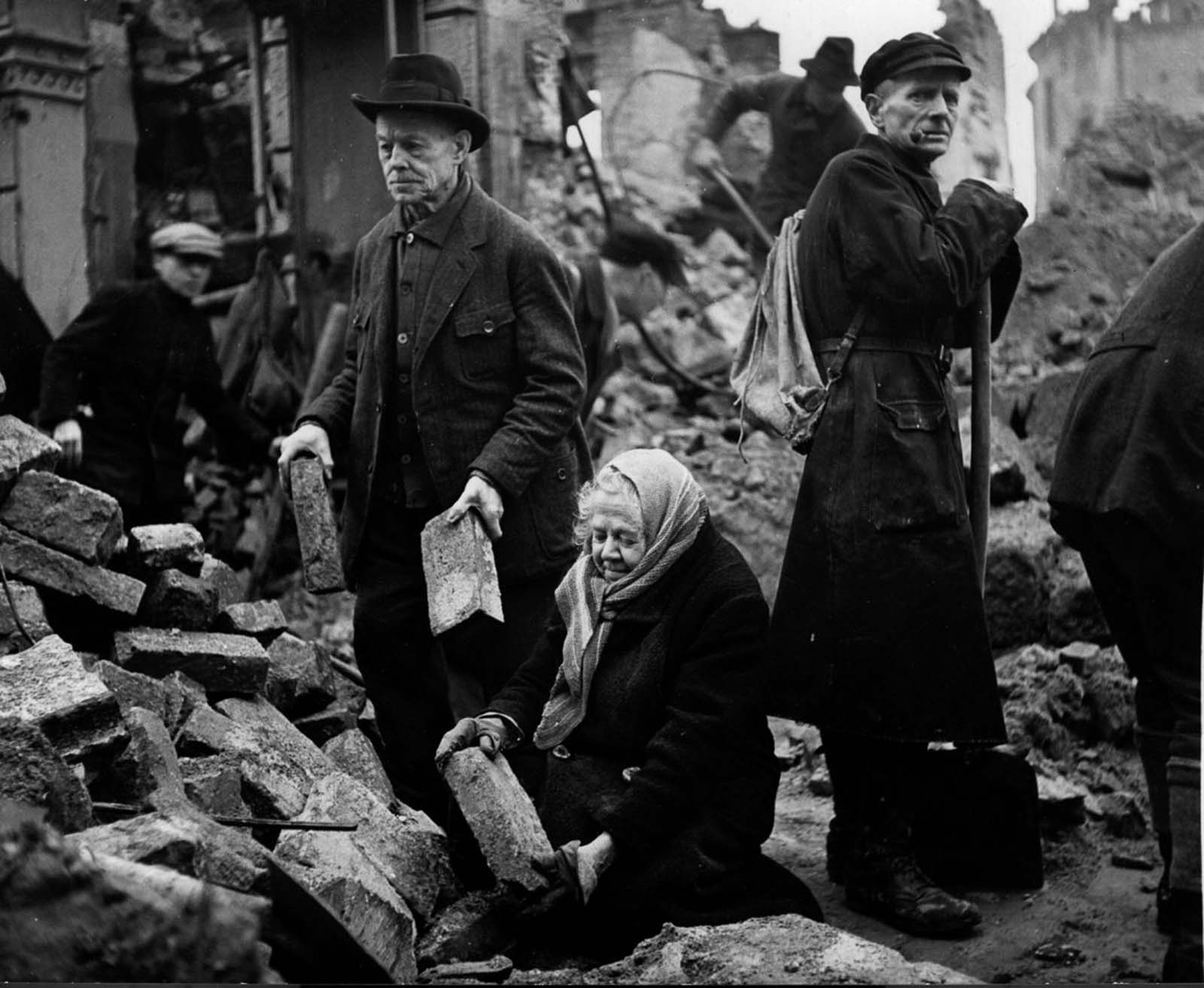 Gustav and Alma Piltz help to clear rubble, 1946.