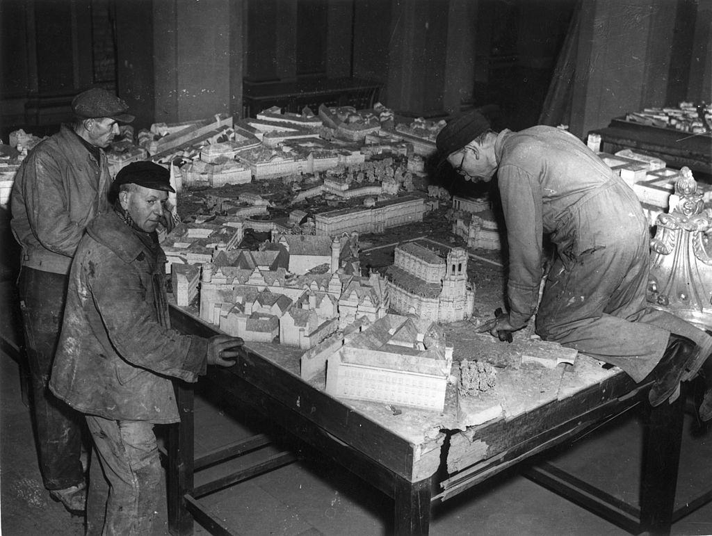 Workmen assemble a scale model of Dresden as it should look in twelve years time, after its reconstruction by the Russian occupying forces.