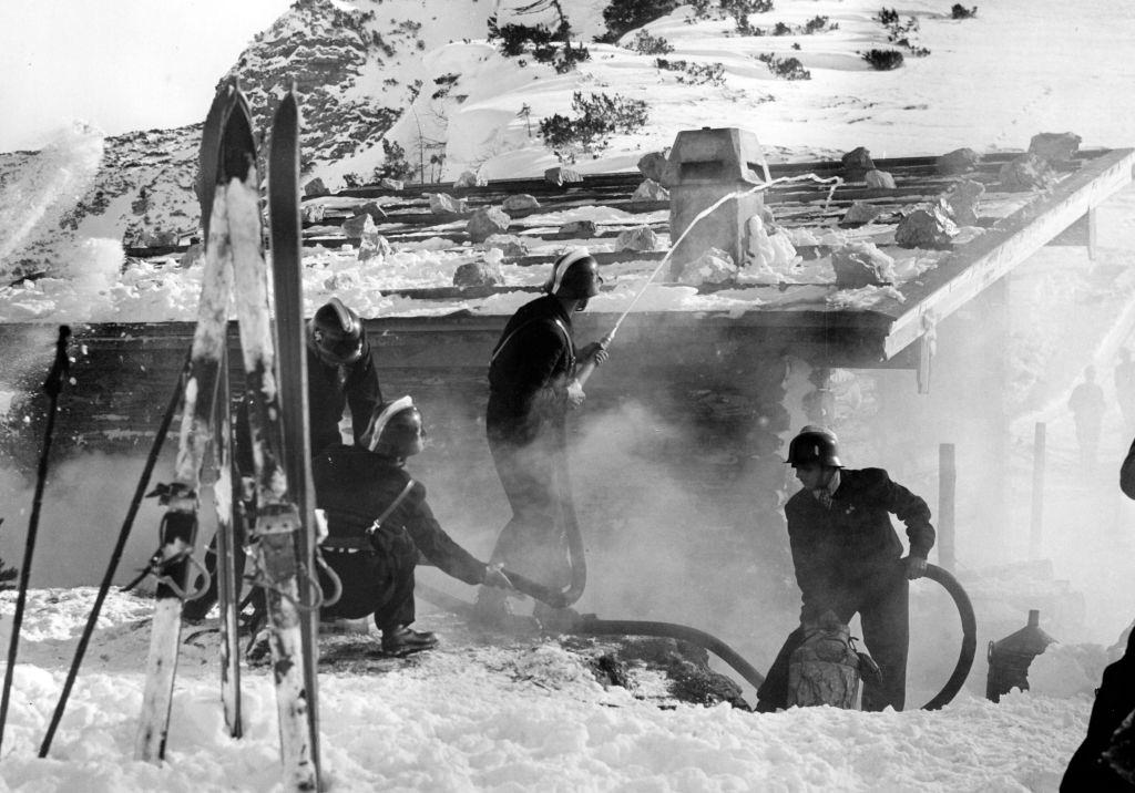 Volunteer firefighters extinguish a fire during an exercise in Bad Reichenhall, Germany, February 1939.
