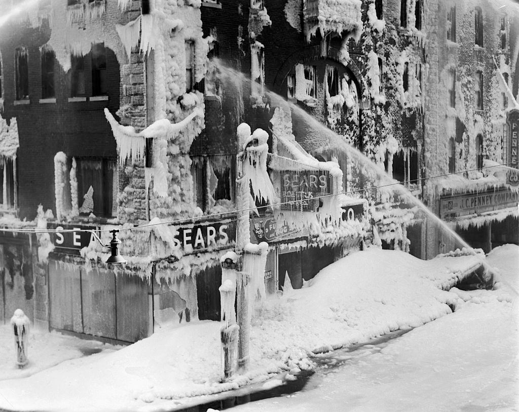 Firefighters finish extinguishing a fire at a hotel in Burlington by a temperature below zero degree in Vermont, 1940.