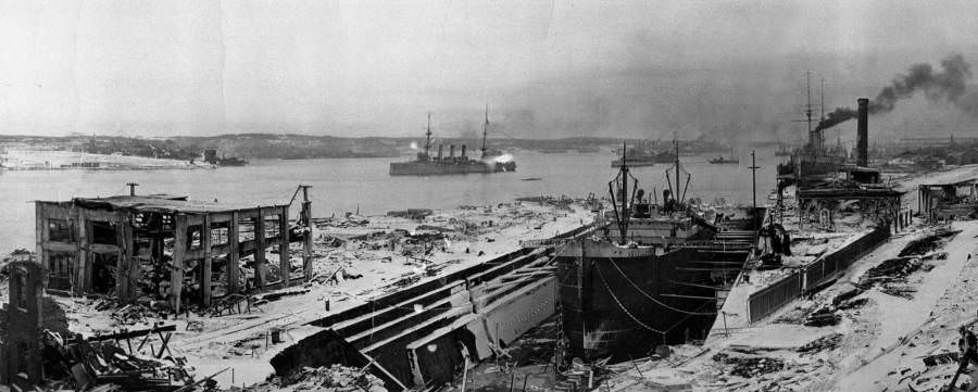 A pair of boats starts to move once more amid the devastation of Halifax Harbor.