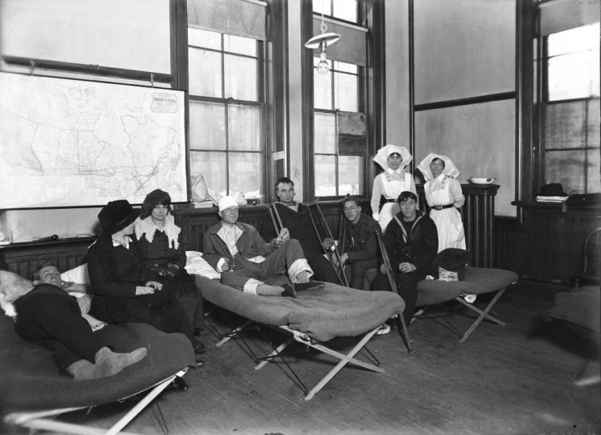 Nurses help the wounded inside of a temporary hospital.