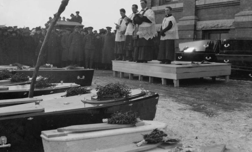 Caskets for the recovered dead are laid out for burial.