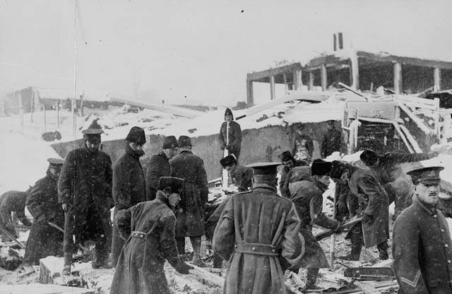 Soldiers move onto the scene, trying to rescue anyone they can from under the rubble and debris.