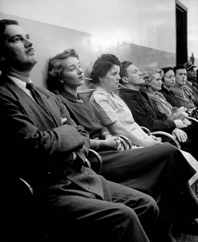 Employees having their temperature taken in the store's hospital.