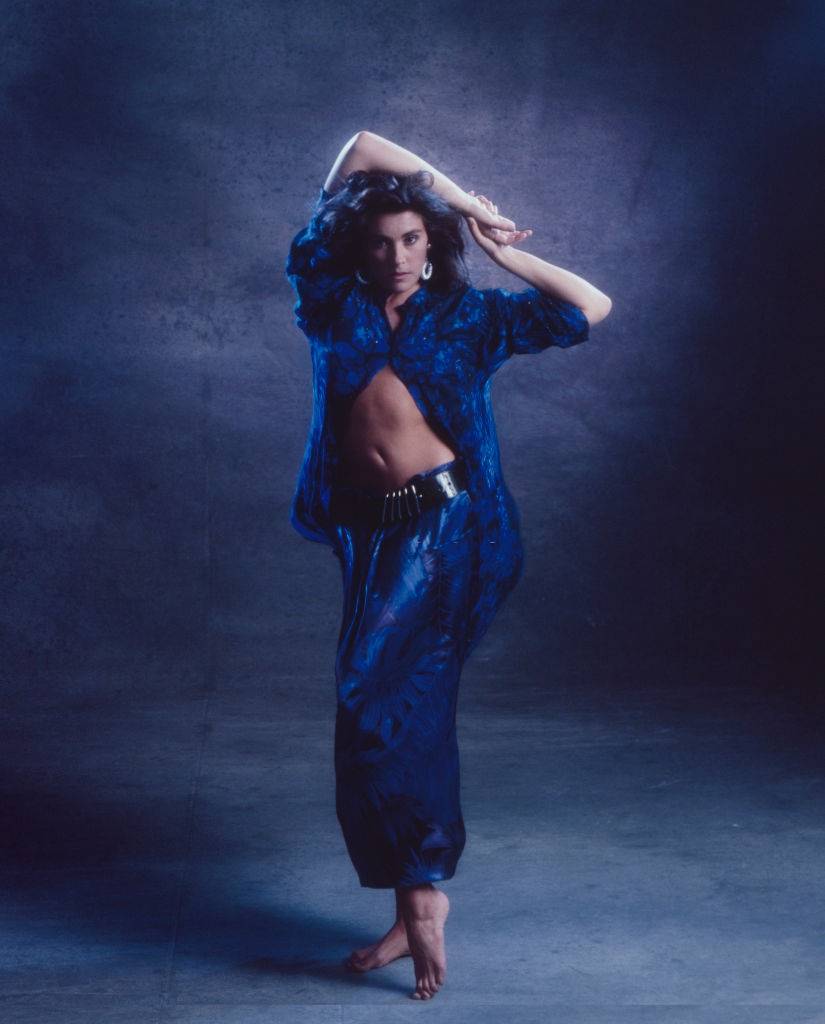 Laura Branigan posing in blue dress, 1985.