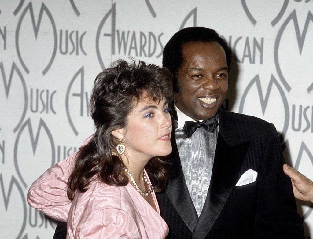 Laura Branigan with Lou Rawls during The 14th Annual American Music Awards at Shrine Auditorium in Los Angeles.